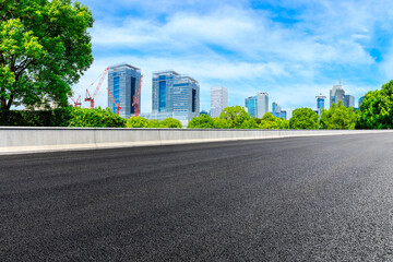 Fototapeta na wymiar Empty asphalt road and Shanghai skyline with buildings scenery.