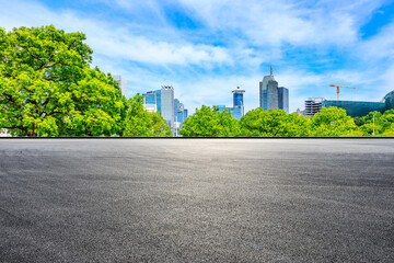 Fototapeta na wymiar Empty asphalt road and financial district buildings in Shanghai,China.