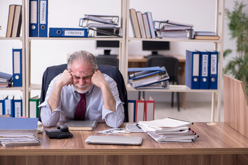 Old male employee unhappy with excessive work