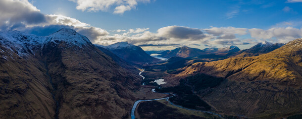aerial view of glen etive in winter near rannoch moor in the argyll region of the highlands of scotland showing snow dusting on the mountains and munros