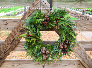Pinecone and berry wreath decor
