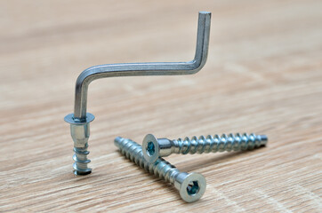 Furniture assembly tools on a wooden background