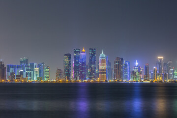 Fototapeta na wymiar Skyline of Doha city at night, west bay of Doha city center after sunset