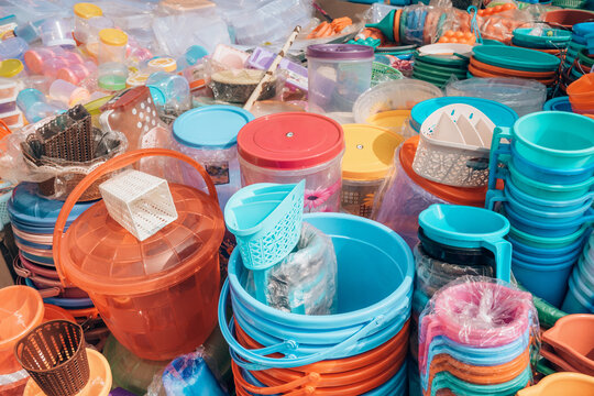 Cheap plastic household items for sale on the market close-up
