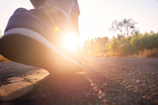 Close Up Shoe Back Side View Of Young Man Start Running On The Road. Jogging,happy,park,out Door.Photo Concept Relaxing And Lifestyle Background.