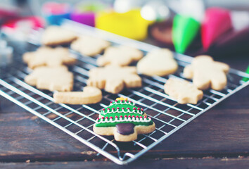 Christmas cookies on wooden table in kitchen at home. Merry Christmas and Happy New Year