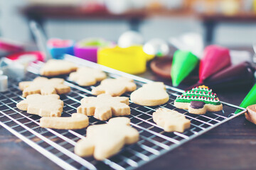 Christmas cookies on wooden table in kitchen at home. Merry Christmas and Happy New Year