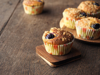 Blueberry muffins on wooden table