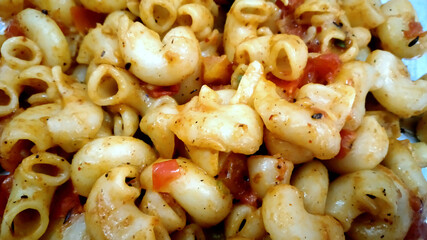 elbow macroni vegetable pasta in red tomato souce
