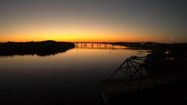 Sunrise behind interstate 4 bridge over lake Monroe Florida
