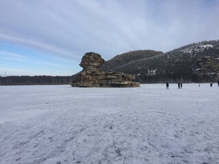 a mountain in the middle of a lake in ice