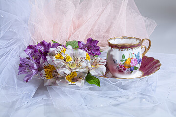 Obraz na płótnie Canvas Cup Of Tea And Flowers