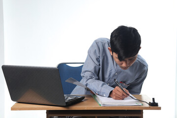 portraits of Asian men seriously working on reports on computers and notebooks. office employee bustling concept with isolated white background