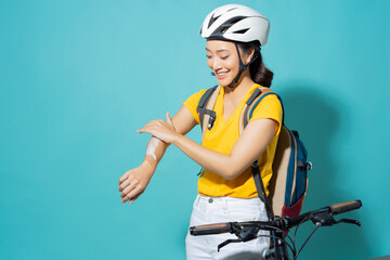 Beautiful asian women She is cycling in the sun. She applied the cream and lotion.