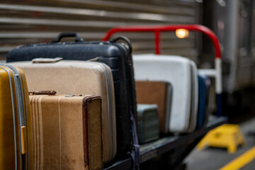 Old vintage suit cases at a train station
