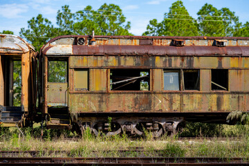 Fototapeta na wymiar Abandoned old train on tracks photo