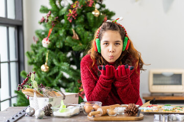 Portrait of happy cute girl playing on Christmas at home. Christmas holidays concept. Merry Christmas and Happy New Year