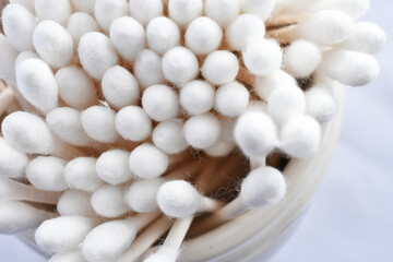 Fototapeta na wymiar A top view image of several white fluffy cotton swabs. 
