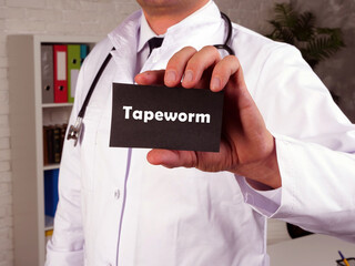 Health care concept meaning Tapeworm with inscription on the page.