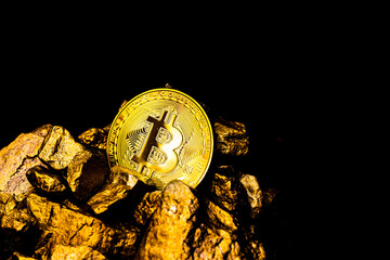 Fototapeta na wymiar Golden Bitcoin Coin and mound of gold. Bitcoin cryptocurrency. Blockchain Technology concept. Crypto investment security and strategy.