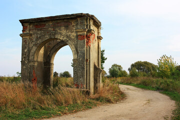 Stone dilapidated gate in an old manor