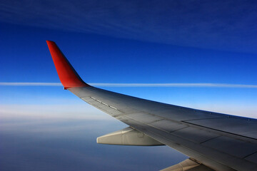 Fototapeta premium Wing aircraft in the blue sky