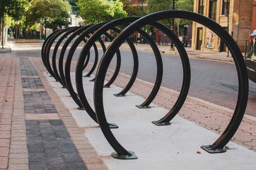 empty circular bike rack on an empty street during summer 2020 in the Exchange District in Winnipeg...