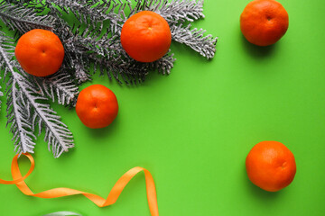 Fototapeta na wymiar mockup christmas card. fir branches, Christmas toys and tangerines 