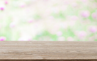 Wooden decking with space for placement of advertising materials. And with a flower background
