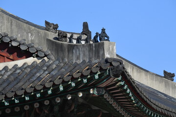 Fototapeta na wymiar The shamanistic figure of a goblin, dragon, pig, monkey, etc. installed on the roof to prevent death or fire in a palace during the Joseon Dynasty.