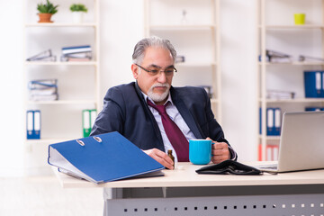 Old businessman employee in bankruptcy concept