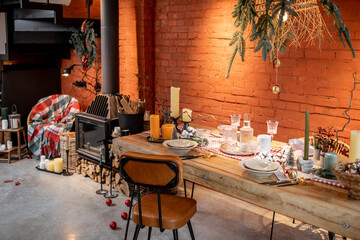 Stylish home interior with festively decorated dining table. The concept of interior design during the New Year holidays