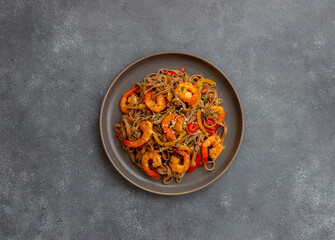 Noodles with shrimps, pepper and soy sauce. Asian food. Wok.