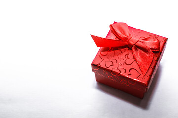Christmas present - red gift box on white background. Creative Flat layout and top view composition...