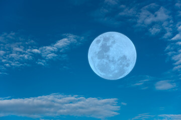 Naklejka na ściany i meble Full moon on blue sky in the morning.