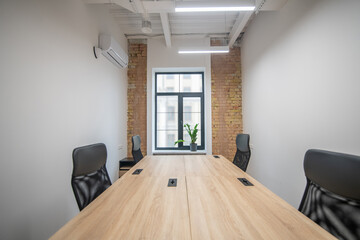Light office with new furniture and striplights