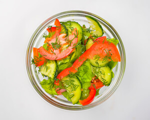 Salad food - mix vegetable salad served in a bowl over white background. Healthy eating, delicious snack or dinner.