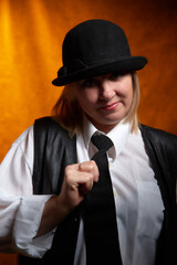 Portrait of fat plump chubby middle-aged woman with hat. Model posing in male style in the Studio.
