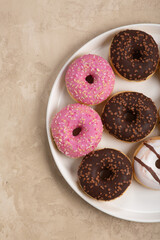 colorful donuts on rustic textured background