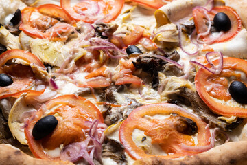 Delicious juicy pizza close-up. View from above.