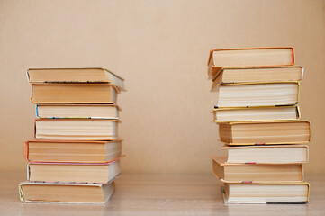 A stack of books stand on the table