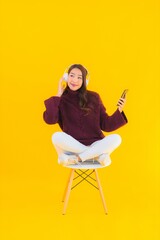 Fototapeta premium Portrait beautiful young asian woman use smart mobile phone listen music