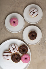 colorful donuts on rustic textured background