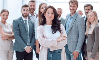 Fototapeta premium confident young woman standing in front of the business team.