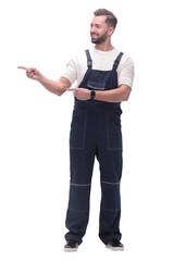smiling man in overalls pointing to a copy of the space