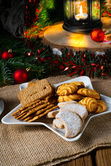 Different types of biscuits with rustic Christmas decorations