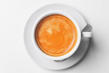 Coffee espresso isolated on white. Served in a white cup with a spoon. Coffee time, close up photo