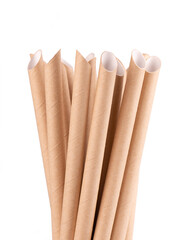 Brown paper drinking straws, isolated on white background. Eco-friendly paper straw, environmental consciousness concept. Close up.