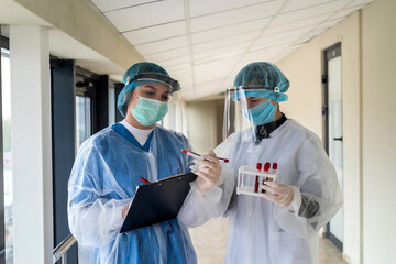 Fototapeta na wymiar two nurses work with blood samples to determine the outcome of a coronavirus infection