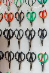 Many different vintage, antique, rustic, authentic, big and small scissors